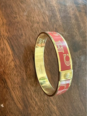 Coach enamel bangle bracelet, pink, blush, logo, lettering trimmed in gold